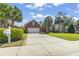 Charming brick home with a two-car garage, landscaped yard, and well-maintained driveway at 806 Compass Point Dr., North Myrtle Beach, SC 29582