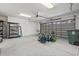 Spacious two-car garage with storage shelving, overhead lighting, and an automatic door at 806 Compass Point Dr., North Myrtle Beach, SC 29582