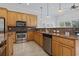 Well-equipped kitchen featuring stainless steel appliances, granite countertops, and custom wood cabinetry at 806 Compass Point Dr., North Myrtle Beach, SC 29582