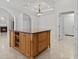 View of kitchen island in an open floor plan; note the stone countertops and wood cabinets at 806 Compass Point Dr., North Myrtle Beach, SC 29582