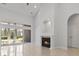 Bright living room with a fireplace, and sliding glass doors leading to the backyard at 806 Compass Point Dr., North Myrtle Beach, SC 29582