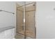 Modern glass enclosed walk-in shower with tile surround and built-in bench at 806 Compass Point Dr., North Myrtle Beach, SC 29582