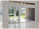 Bright sunroom featuring tile floors, sliding glass doors, and a view of the backyard at 806 Compass Point Dr., North Myrtle Beach, SC 29582