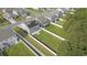 Aerial view of a home with solar panels and a large backyard with a white fence at 8076 Fort Hill Way, Myrtle Beach, SC 29579