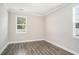 Well-lit bedroom with modern flooring and a large window at 8076 Fort Hill Way, Myrtle Beach, SC 29579