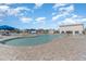 A beautifully landscaped community pool with lounge chairs and umbrellas at 8076 Fort Hill Way, Myrtle Beach, SC 29579