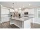 Well-lit kitchen features stainless steel appliances, granite countertops, and white cabinetry at 8076 Fort Hill Way, Myrtle Beach, SC 29579