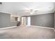 Large living room featuring plush carpeting and lots of space at 8076 Fort Hill Way, Myrtle Beach, SC 29579