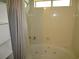 View of the shower and jacuzzi tub in the bathroom with a light beige surround at 811 Rogers Rd., Myrtle Beach, SC 29577