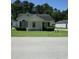 Charming single-story home featuring a cozy front porch and well-maintained landscaping at 811 Rogers Rd., Myrtle Beach, SC 29577