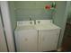 The laundry room features a washer and dryer with storage shelf above at 811 Rogers Rd., Myrtle Beach, SC 29577