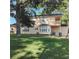 This home offers a blend of classic design, a lush green lawn, and mature trees that provide shade and privacy at 903 23Rd Ave. N, North Myrtle Beach, SC 29582