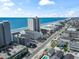 Aerial view of an oceanfront community with multiple buildings, swimming pools, and views of the ocean at 920 N Waccamaw Dr. # 2102, Murrells Inlet, SC 29576