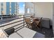 Comfortable balcony with lounge seating and table/chairs with view of the beach at 920 N Waccamaw Dr. # 2102, Murrells Inlet, SC 29576