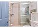 Modern bathroom featuring glass enclosed tiled shower and stylish fixtures at 920 N Waccamaw Dr. # 2102, Murrells Inlet, SC 29576