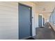 View of apartment hallway featuring doors with keypads and unit numbers for added security at 920 N Waccamaw Dr. # 2102, Murrells Inlet, SC 29576
