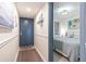 Hallway view leading to a beautifully decorated bedroom with a queen bed and coastal theme at 920 N Waccamaw Dr. # 2102, Murrells Inlet, SC 29576