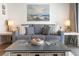 Cozy living room features a comfortable couch, a decorative coffee table, and nautical accents at 920 N Waccamaw Dr. # 2102, Murrells Inlet, SC 29576