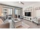 Cozy living room with a comfortable couch, a TV, and sliding doors to a private balcony at 920 N Waccamaw Dr. # 2102, Murrells Inlet, SC 29576