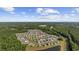 Drone view showing community nestled among the mature forests of South Carolina at 924 Akron St., Conway, SC 29526