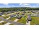 An aerial view of a neighborhood featuring single-Gathering homes, lush green lawns, and mature trees at 924 Akron St., Conway, SC 29526