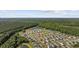 Aerial view of community homes next to pond and surrounded by forest, offering privacy and views at 924 Akron St., Conway, SC 29526