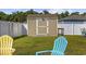 Neat backyard featuring a shed, lush grass, and a white privacy fence at 924 Akron St., Conway, SC 29526