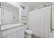 Bright bathroom with white vanity, granite countertop, toilet, and shower with curtain at 924 Akron St., Conway, SC 29526