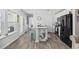 Island kitchen with modern appliances, eat-in seating, granite countertops, and ample cabinet space at 924 Akron St., Conway, SC 29526