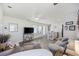 Bright, open-concept living area with kitchen access, ceiling fan, television, and natural light at 924 Akron St., Conway, SC 29526