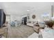 Open-concept living room featuring modern flooring, neutral colors, and a view into the kitchen area at 924 Akron St., Conway, SC 29526