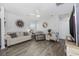 Cozy living room features hardwood floors, neutral walls, comfortable seating, and stylish decor at 924 Akron St., Conway, SC 29526