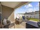 Comfortable covered patio with an outdoor seating area, perfect for relaxing and entertaining at 924 Akron St., Conway, SC 29526