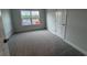 Bedroom with neutral paint, carpet flooring and a window to let in natural light at 9409 Long Meadow Way, Longs, SC 29568