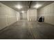 Spacious unfinished two car garage with concrete floor and drywall at 9409 Long Meadow Way, Longs, SC 29568