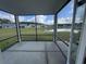 Enclosed porch with view of the lake at 9409 Long Meadow Way, Longs, SC 29568