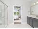 Bright bathroom featuring shower and tub with a view into main bedroom at 9419 Long Meadow Way, Longs, SC 29568