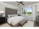 Spacious main bedroom with natural light, ceiling fan and contemporary furnishings at 9419 Long Meadow Way, Longs, SC 29568