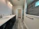 Modern bathroom with double vanity, tiled shower, and sleek fixtures at 1000 Lady Bird Way, North Myrtle Beach, SC 29582
