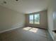 Cozy bedroom with natural light streaming through the double windows at 1000 Lady Bird Way, North Myrtle Beach, SC 29582