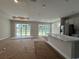 Bright, open-concept kitchen with large sliding glass doors to backyard at 1000 Lady Bird Way, North Myrtle Beach, SC 29582
