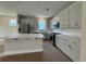 Stylish kitchen features white cabinets, an island and stainless steel appliances at 1000 Lady Bird Way, North Myrtle Beach, SC 29582
