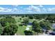 Expansive aerial view of a golf course with a pond and a variety of mature trees at 102 Scotch Broom Dr. # B-204, Little River, NC 29566