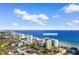 Aerial view of 1105 S Ocean Blvd with ocean views and modern building at 1105 S Ocean Blvd. # 110, Myrtle Beach, SC 29577