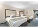 Comfortable bedroom with two beds and soft natural lighting, creating a relaxing ambiance at 1105 S Ocean Blvd. # 110, Myrtle Beach, SC 29577