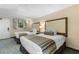 Comfortable bedroom with two beds, soft lighting, and window at 1105 S Ocean Blvd. # 110, Myrtle Beach, SC 29577