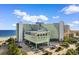 Attractive exterior view of a beachfront resort offering convenient parking and easy access to the sandy shores at 1105 S Ocean Blvd. # 110, Myrtle Beach, SC 29577