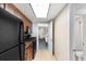 Galley kitchen featuring granite countertops and black appliances at 1105 S Ocean Blvd. # 110, Myrtle Beach, SC 29577