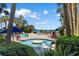 Beautiful outdoor pool surrounded by palm trees and lush landscaping at 1105 S Ocean Blvd. # 110, Myrtle Beach, SC 29577