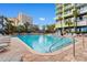 Outdoor pool with poolside seating, umbrellas, and palm trees at 1105 S Ocean Blvd. # 110, Myrtle Beach, SC 29577
